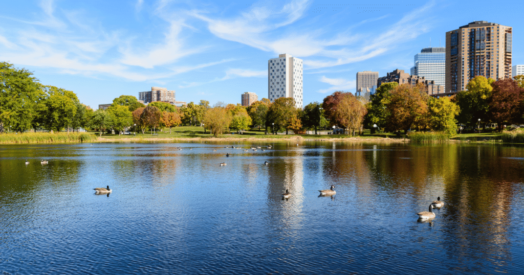 Loring Park in Minneapolis with lake, skyline, and fall colors, a central LGBTQ-friendly neighborhood in the Twin Cities