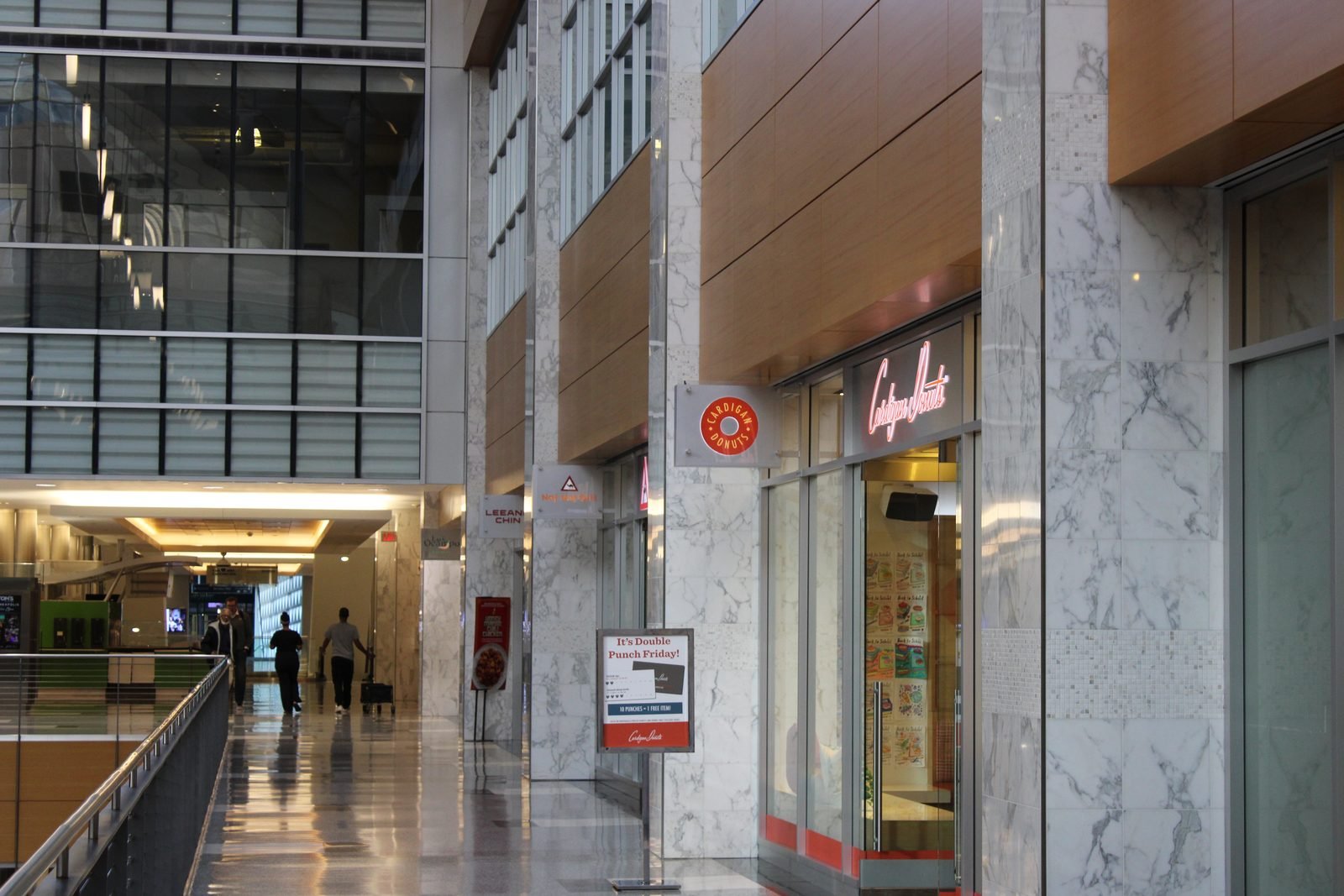 Cardigan Donuts and other local food spots along a marble Minneapolis skyway corridor